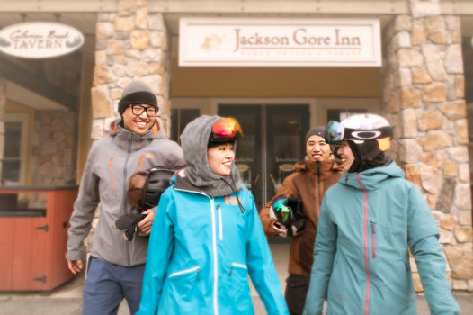 Group of Friends Walking and Talking in Base Area at Okemo