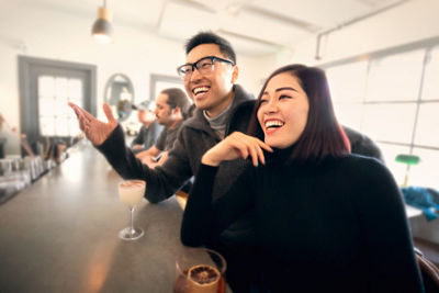 Man and Woman Having Drinks at Bar at Okemo