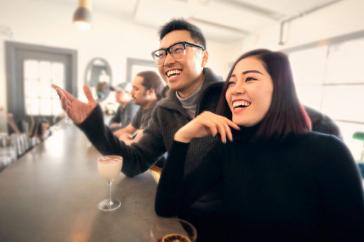 Man and Woman Having Drinks at Bar at Okemo