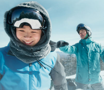 Father and Son Smiling While Taking Break on Trail at Okemo