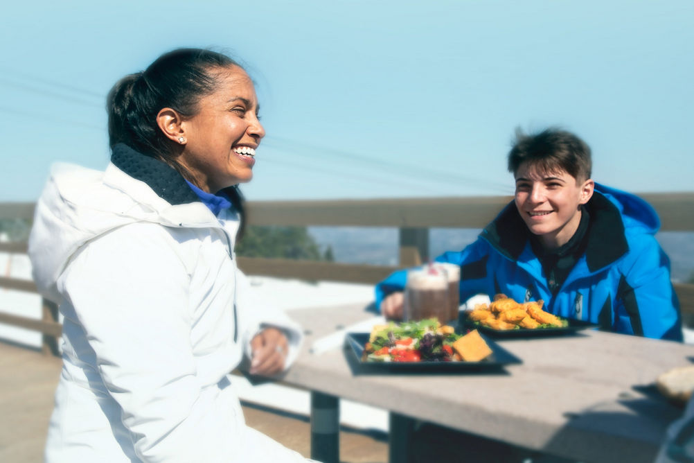 Family Eating Lunch Outside on Porch at Okemo