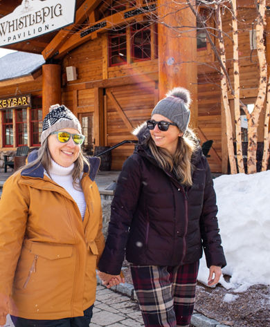 Female couple outside Whistle Pig Pavillion 32