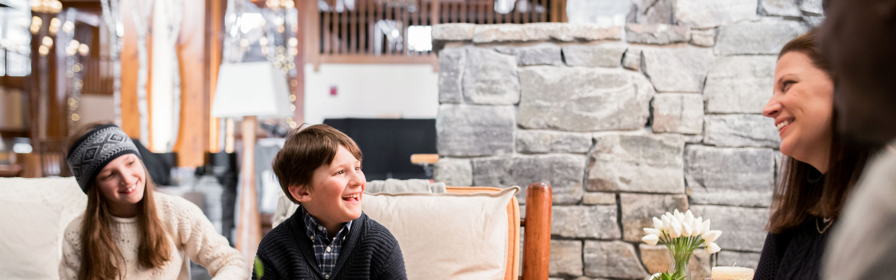 Family Having a Meal Inside Stowe Mountain Lodge at Stowe