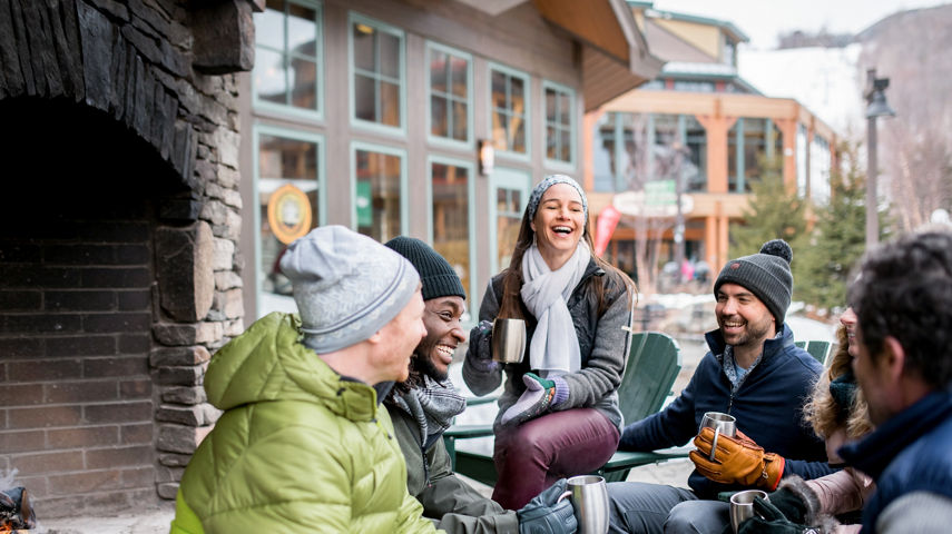 Friends enjoying Spruce Peak Village at Stowe Mountain Resort 