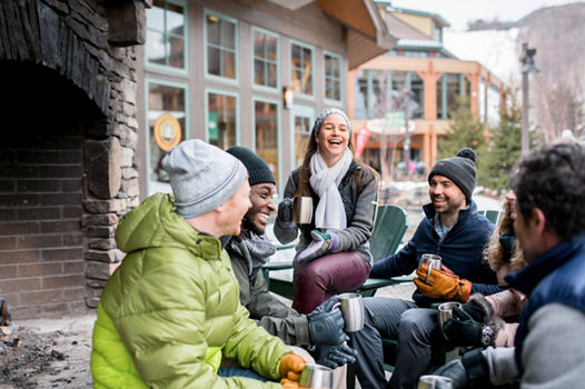 Friends enjoying Spruce Peak Village at Stowe Mountain Resort 
