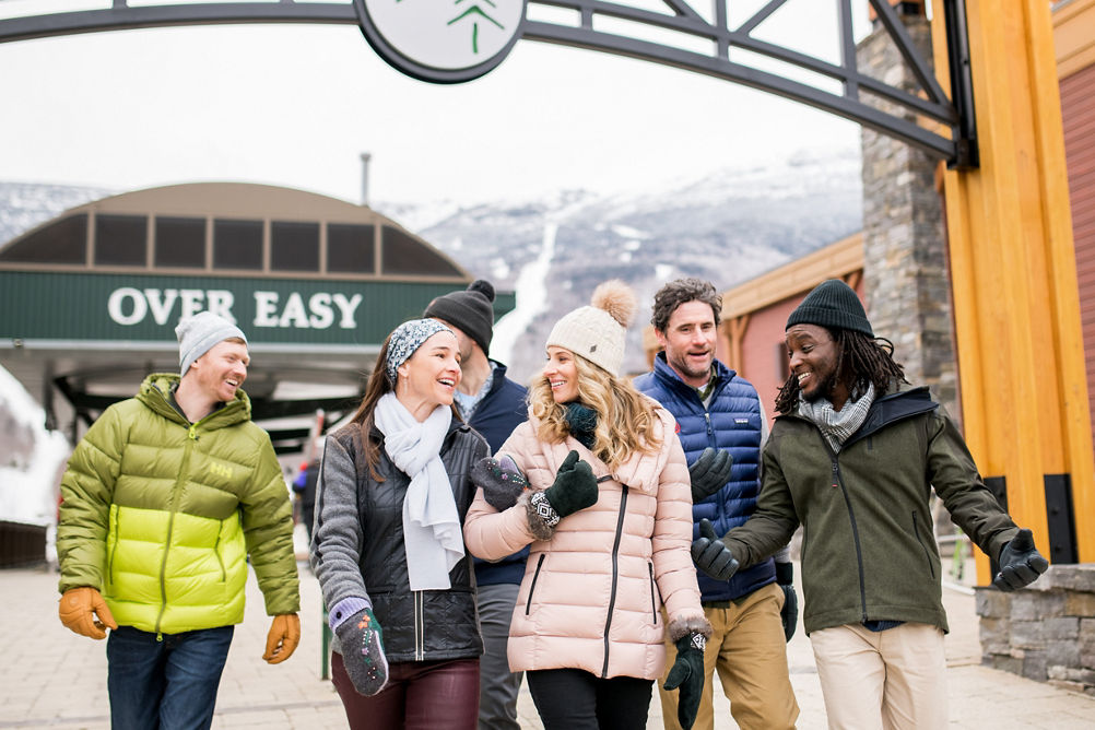 Friends enjoying Spruce Peak Village at Stowe Mountain Resort 