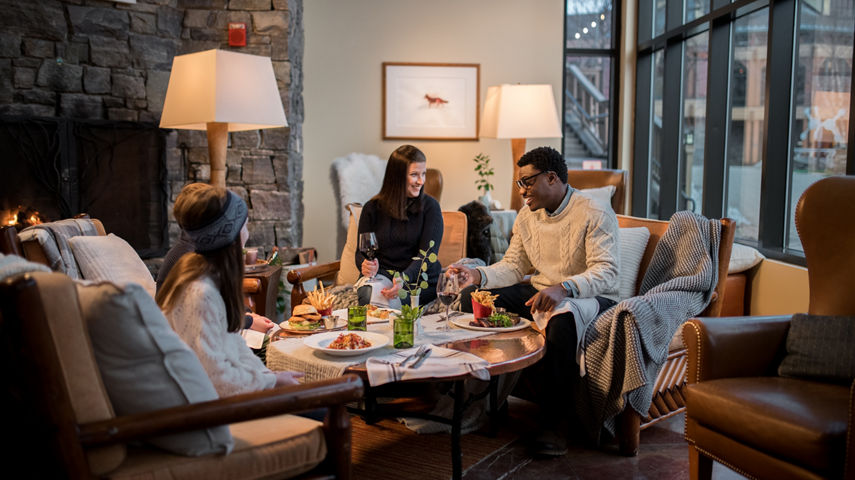 Family Having Food Inside Stowe Mountain Lodge at Stowe