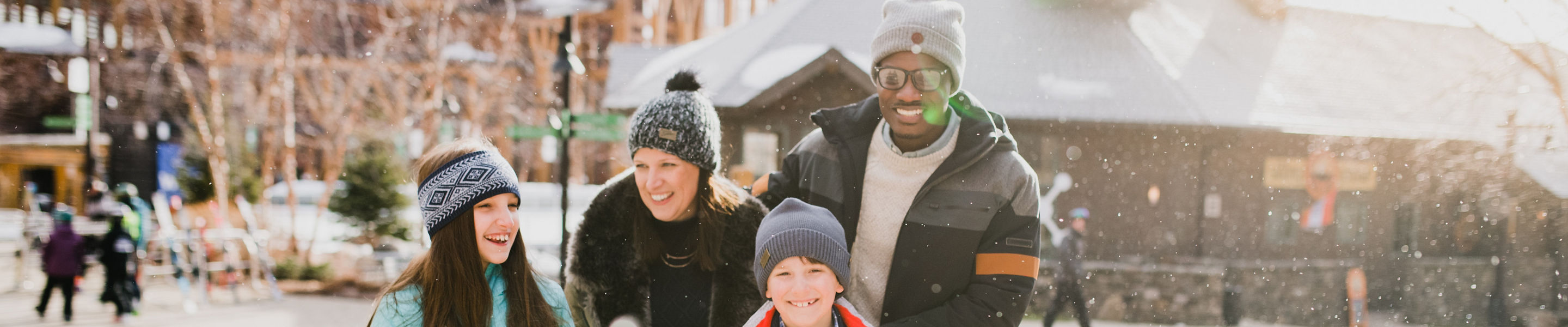 Family Walks Through Spruce Peak Village at Stowe Mountain Resort