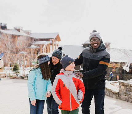 Family Walks Through Spruce Peak Village at Stowe Mountain Resort