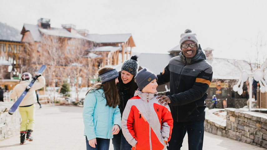 Family Walks Through Spruce Peak Village at Stowe Mountain Resort