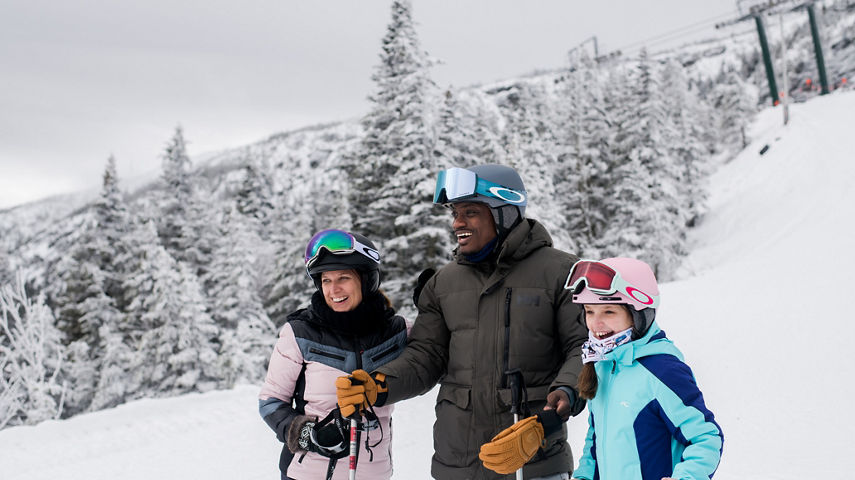 Family Together On Slope at Stowe Mountain Resort 