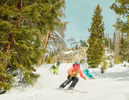 Family skiing in trees at Keystone Resort