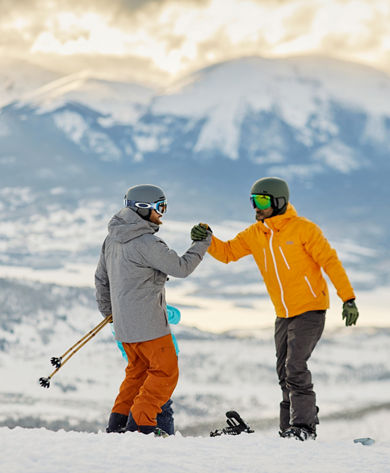 Friends handshake at sunset at Keystone Resort