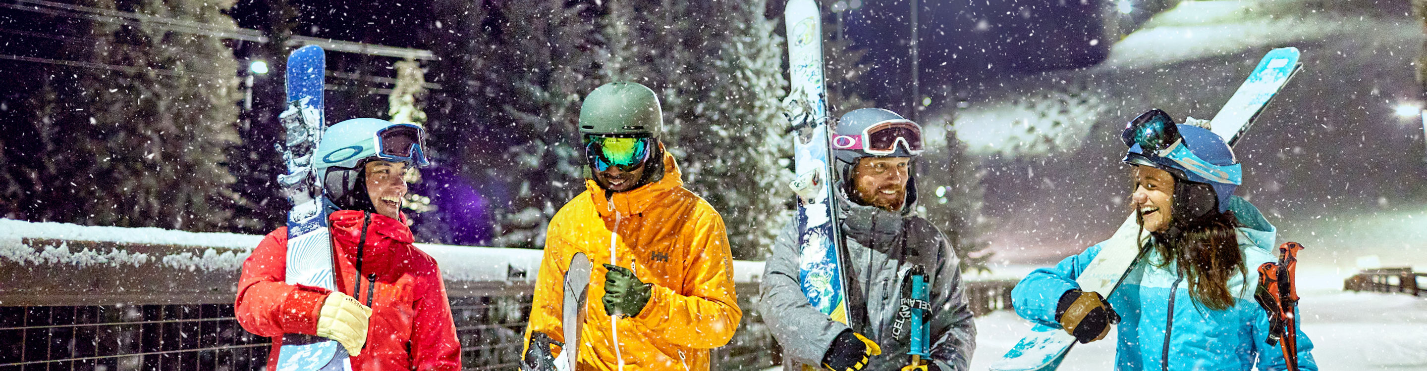 Friend group walking under the lights night skiing at Keystone Resort