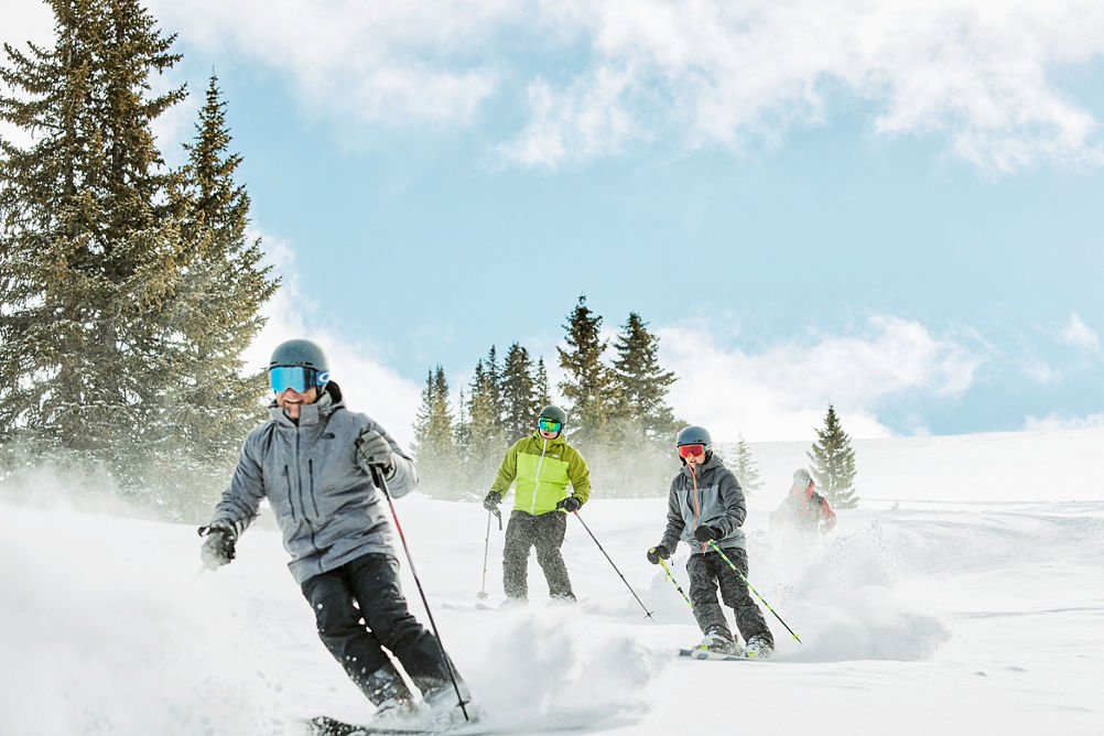 Group riding fresh snow after cat ride at Keystone Resort