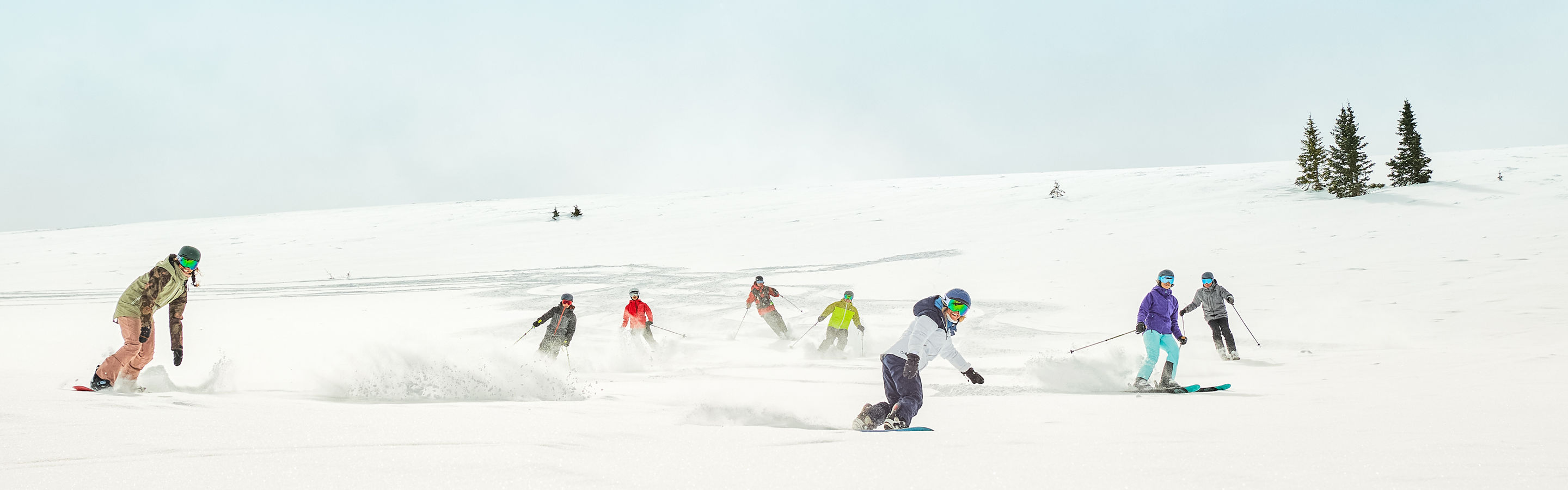 Group riding fresh snow after cat skiing at Keystone Resort