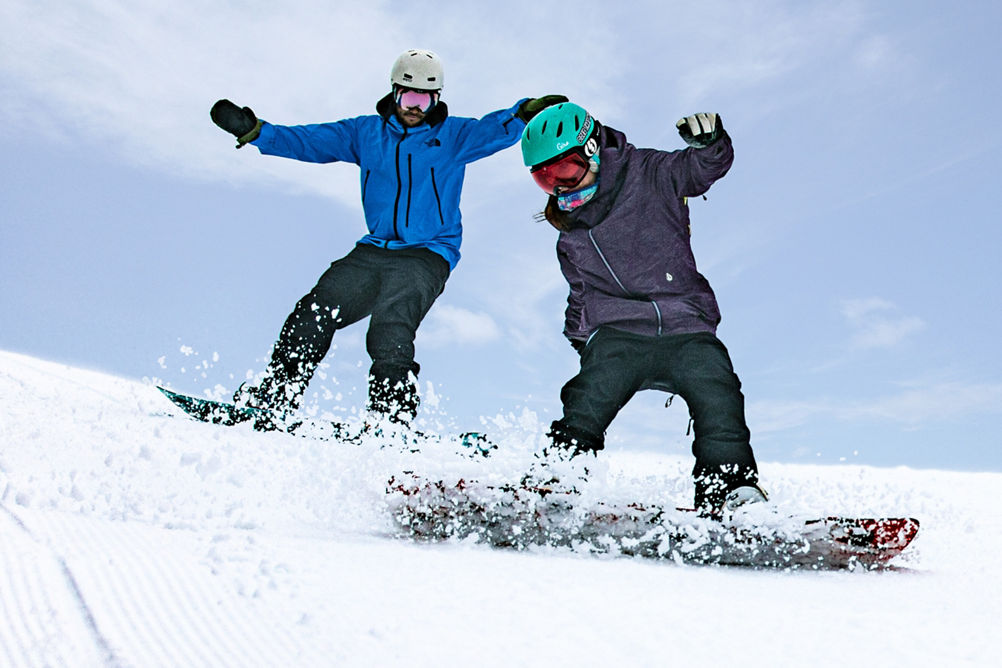 Two Snowboarders Turn on Corduroy Run at Hunter Mountain