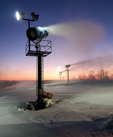 Snow Maker Blows Snow on Ski Runs at Dawn at Paoli Peaks