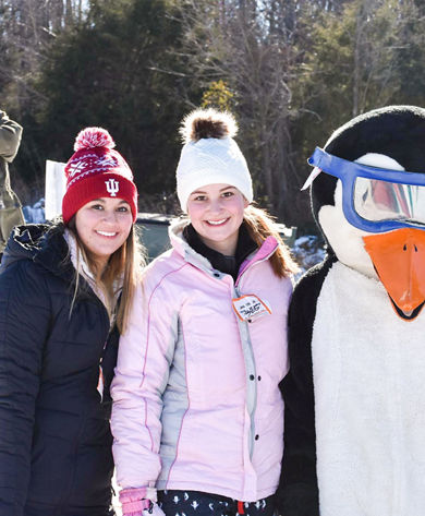 Group Poses with Penguin Mascot at Paoli Peaks