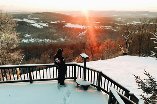 Ski Patroller Overlooks Mountain at the Top of Gunbarrel during Sunrise at Roundtop