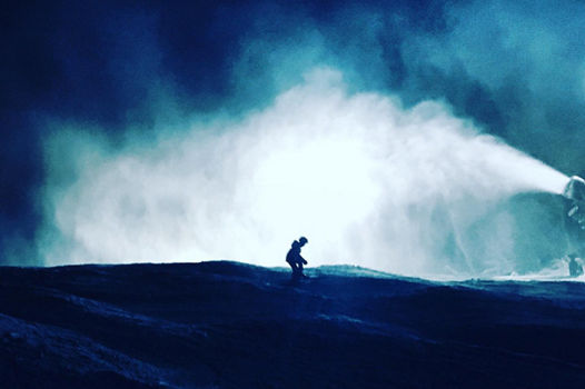 Snowmaker Checks Snow Guns at Night at Roundtop
