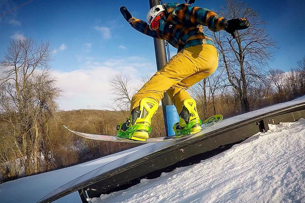 Snowboarder Hits Feature at Terrain Park at Snow Creek