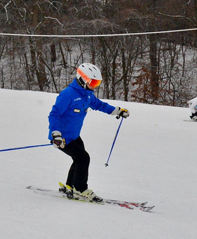 Ski Instructor Makes Turns Downhill at Snow Creek