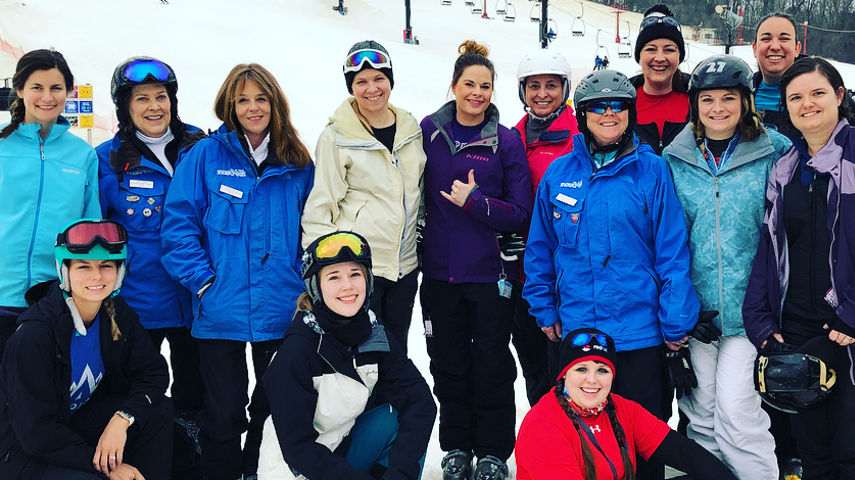 Group of Skiers and Riders Pose at Snow Creek