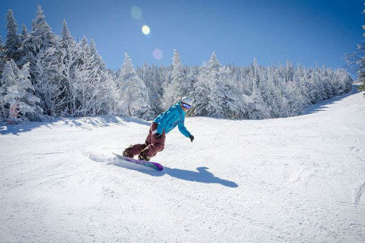 Snowboarder Makes Turns Downhill at Wildcat Mountain