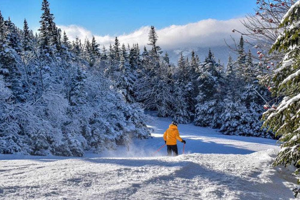 Skier Makes Turns Down Open Ski Run at Wildcat Mountain