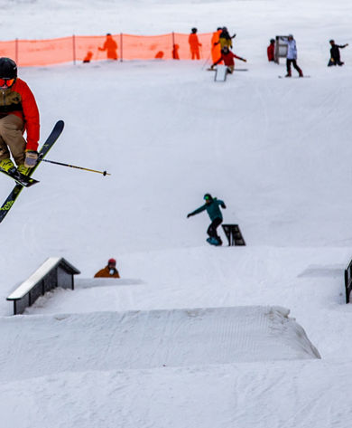 A skier jumps mid-air at the terrain park at Crotched