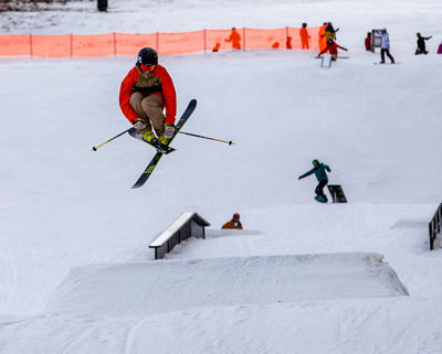 A skier jumps mid-air at the terrain park at Crotched