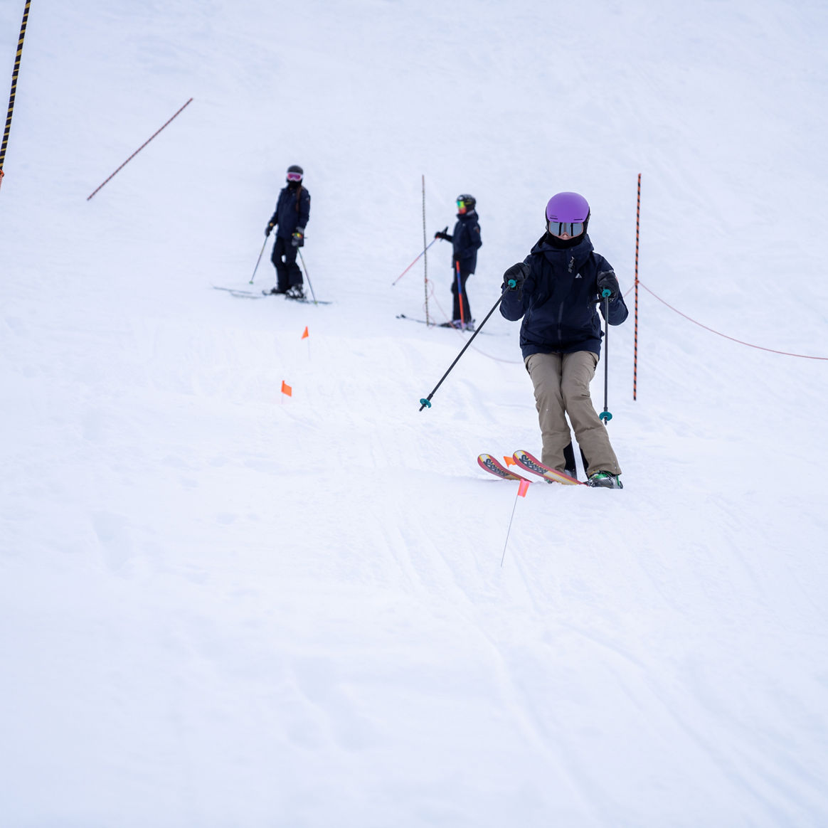 Three downhill skiers at the Whistler Freestyle Club Jan 2021