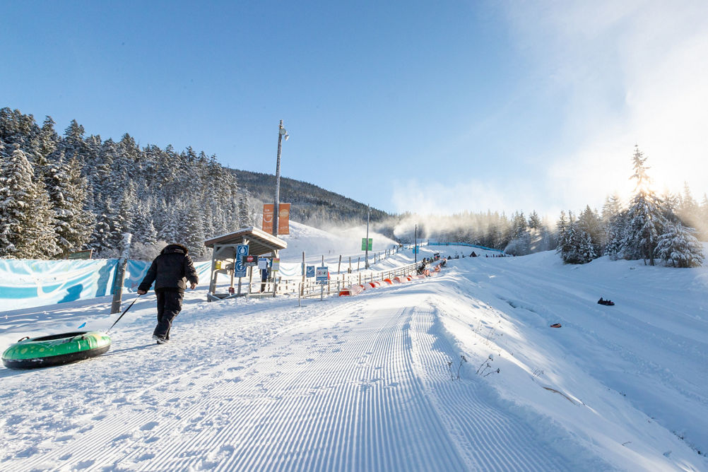 Person walking in the Bubly Tube Park at Whistler