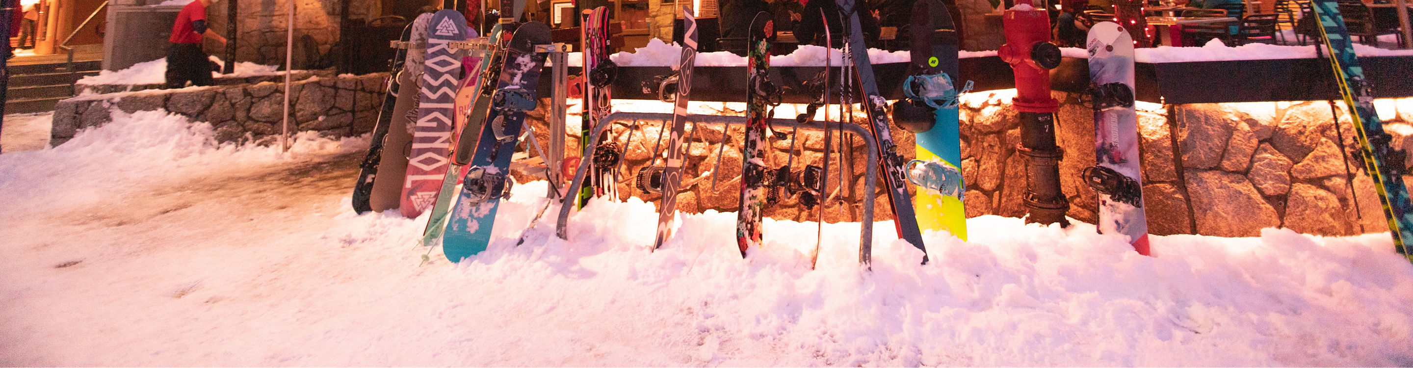 Snowboards in front of a restaurant at Whistler Village