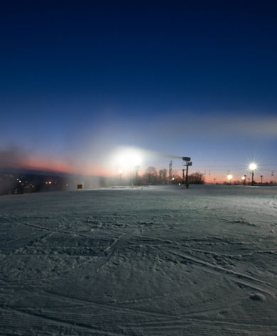 Sunset on the slopes at Paoli Peaks with snow guns on