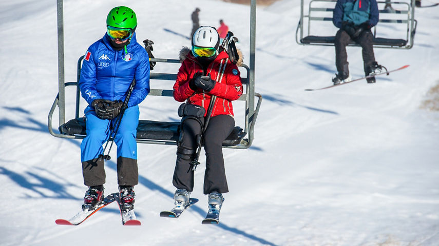 Two Guests Riding Triple Chairlift at Paoli