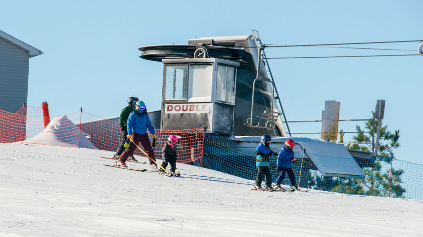 Ski Instructor Teaching Kids to Ski
