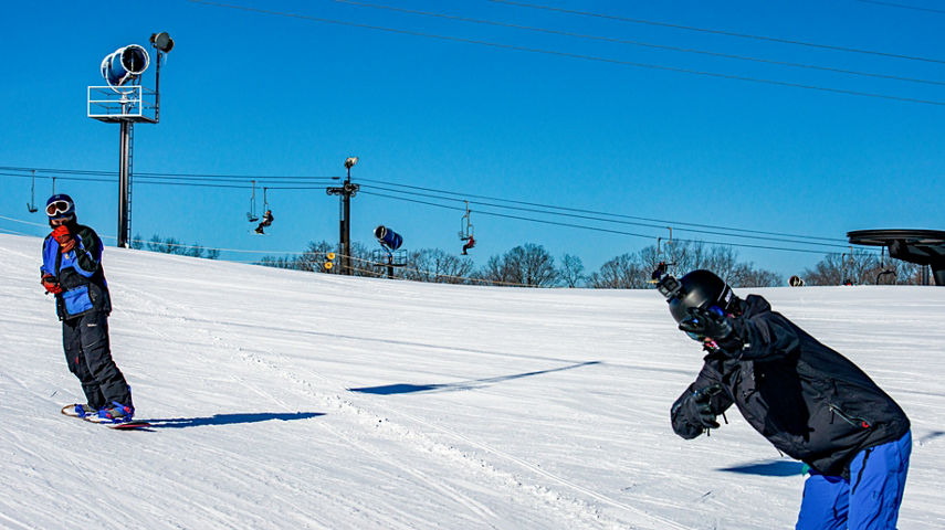 Two Friends Snowboarding Together at Paoli
