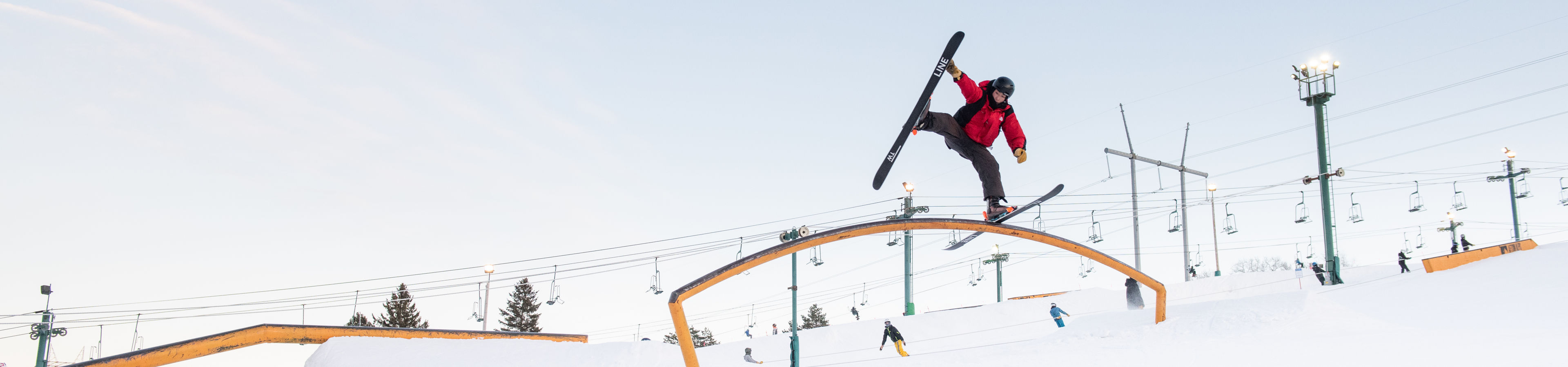 Skier Jumps Mid-Air on Rail in Terrain Park at Afton Alps, MN