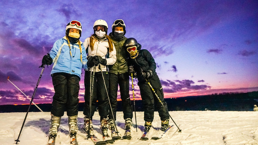 Group of Skiers Pose on top of Mountain at Boston Mills Brandywine