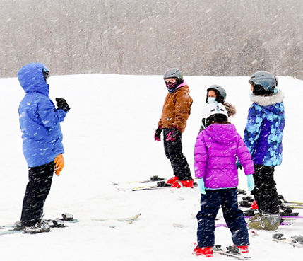Guests participate in ski lessons at Snow Creek