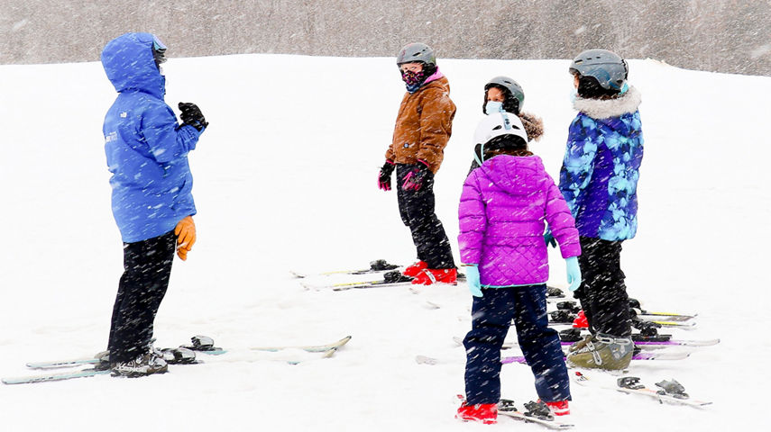 Guests participate in ski lessons at Snow Creek