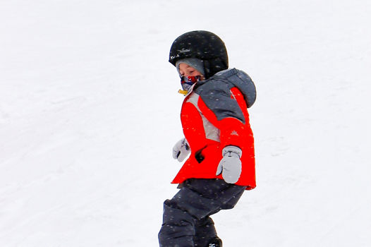 Guest having fun snowboarding at Snow Creek