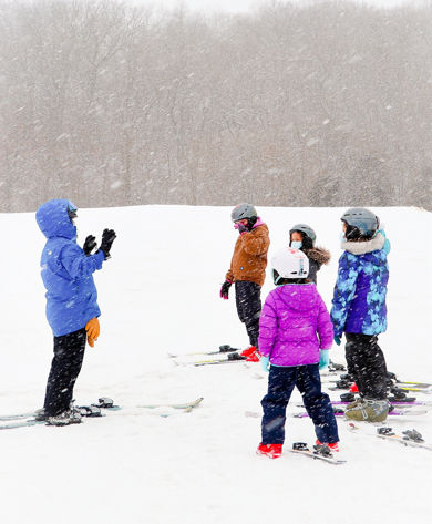 Guests participate in ski lessons at Snow Creek