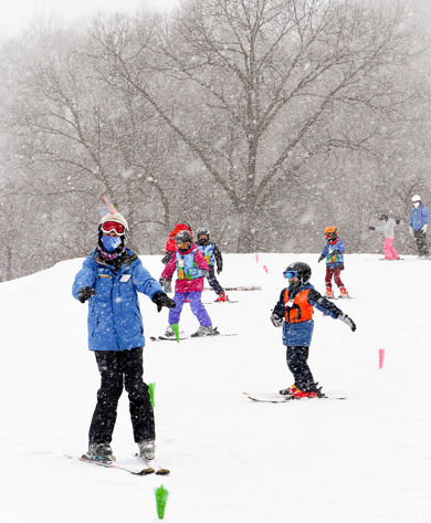 Guests participate in ski lessons at Snow Creek