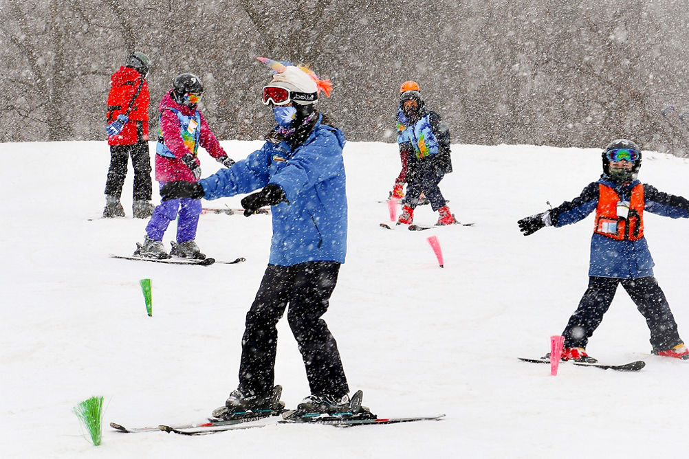 Guests participate in ski lessons at Snow Creek