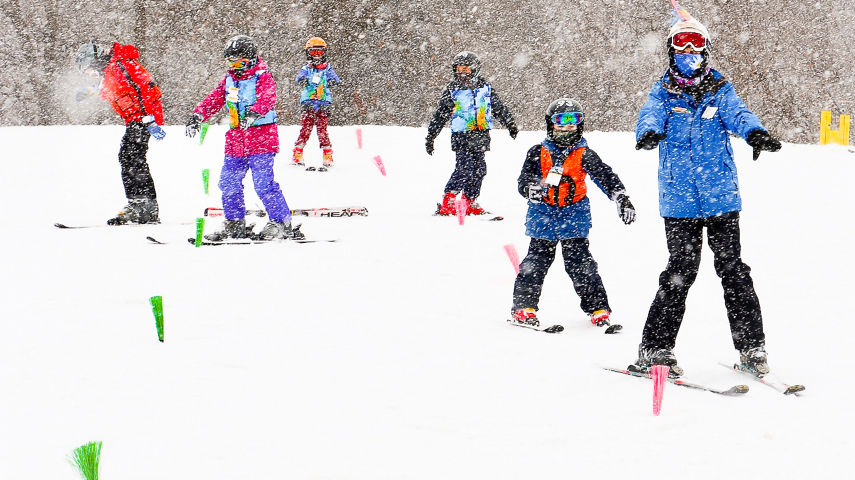 Guests participate in ski lessons at Snow Creek