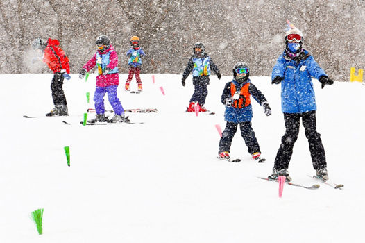 Guests participate in ski lessons at Snow Creek