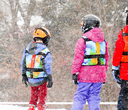 Kids participate in ski lessons at Snow Creek